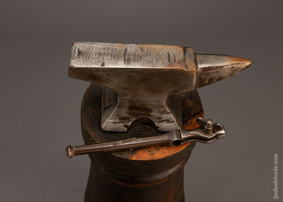 Great-Watch-Maker’s-Anvil-&-Pin-Vise-on-Ornate-Stump-118919