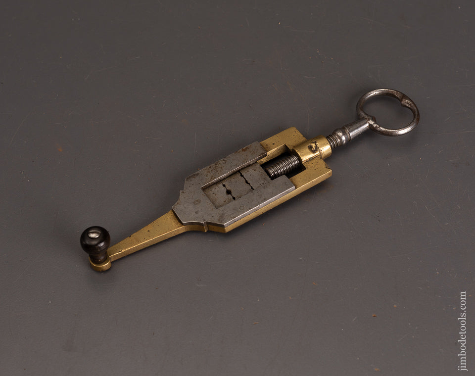 Ornate-Brass-Adjustable-Threading-Tool-120911