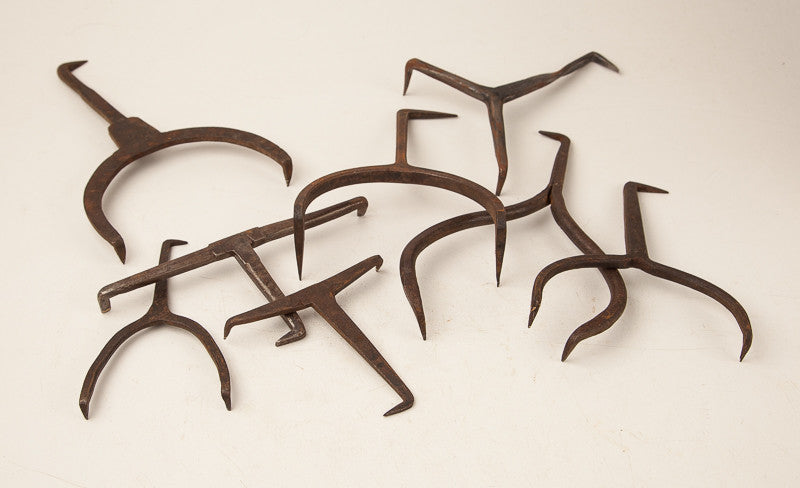 Collection of Eight Hand Forged Bench Dogs