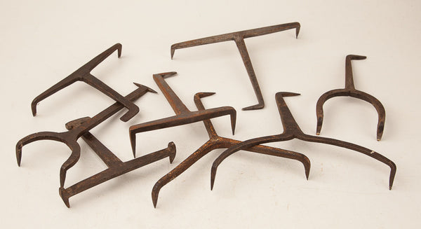 Collection of Eight Hand Forged Bench Dogs