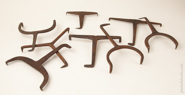 Collection of Eight Hand forged Bench Dogs