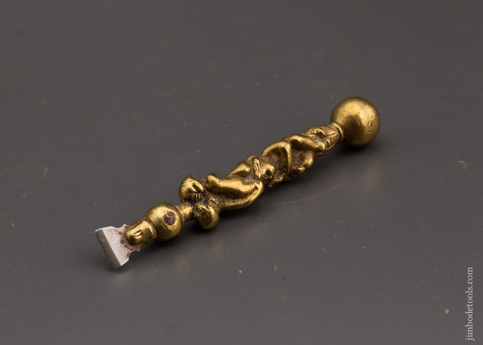 Ornate Figural Brass Button Hole Chisel With 3 Cherubs - 74861U